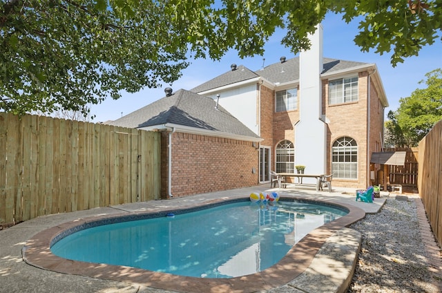 view of swimming pool with a patio area