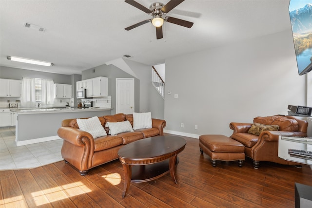 living room with hardwood / wood-style flooring and ceiling fan