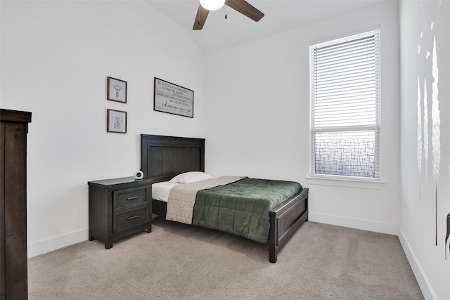 bedroom featuring ceiling fan, light carpet, and lofted ceiling