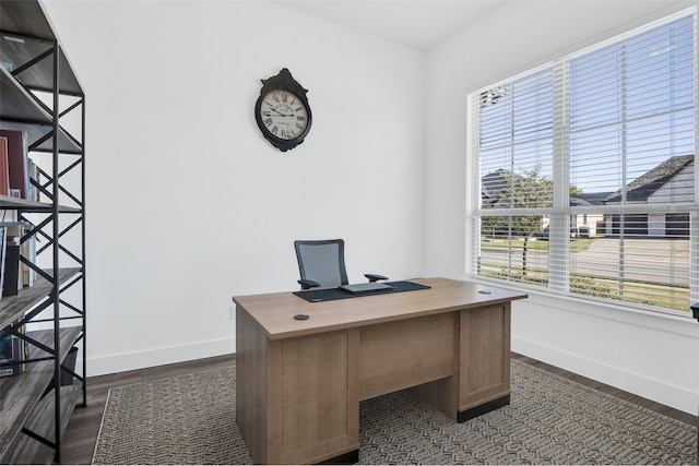 office with dark wood-type flooring