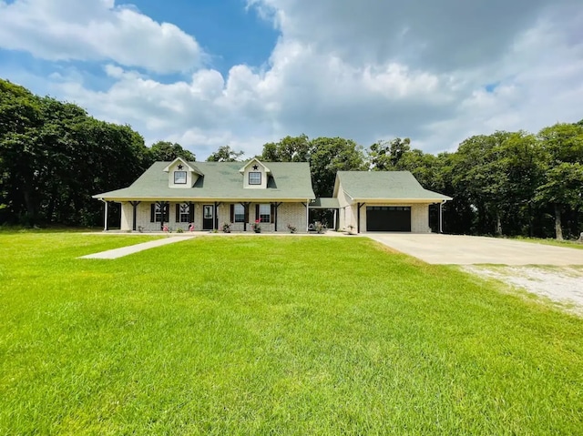 view of front facade with a front yard and a garage