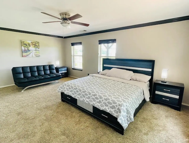 carpeted bedroom featuring crown molding and ceiling fan