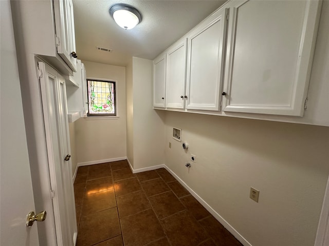 washroom featuring electric dryer hookup, hookup for a gas dryer, washer hookup, and cabinets