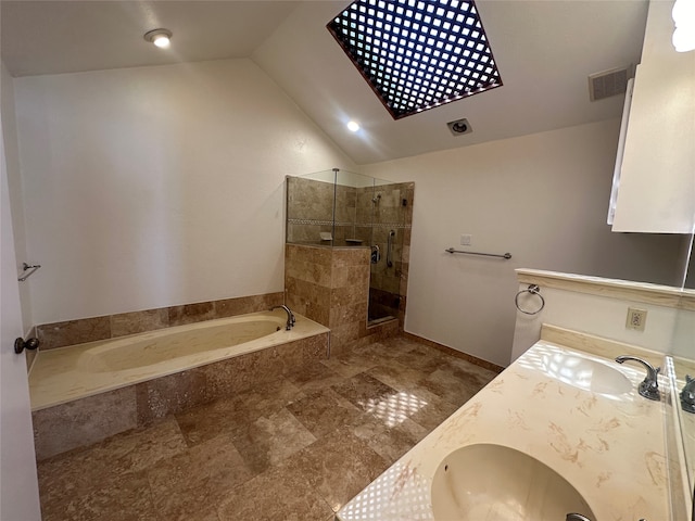 bathroom featuring lofted ceiling, vanity, and separate shower and tub