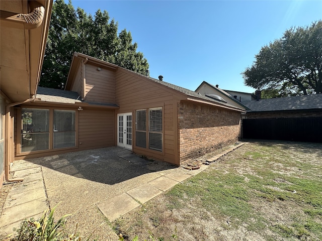 back of house featuring a patio area and french doors