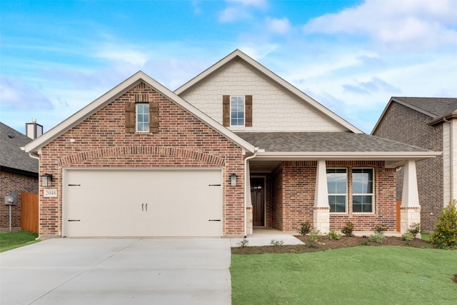 view of front of home featuring a garage and a front lawn