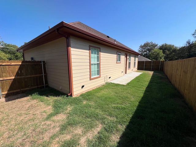 view of property exterior featuring a lawn