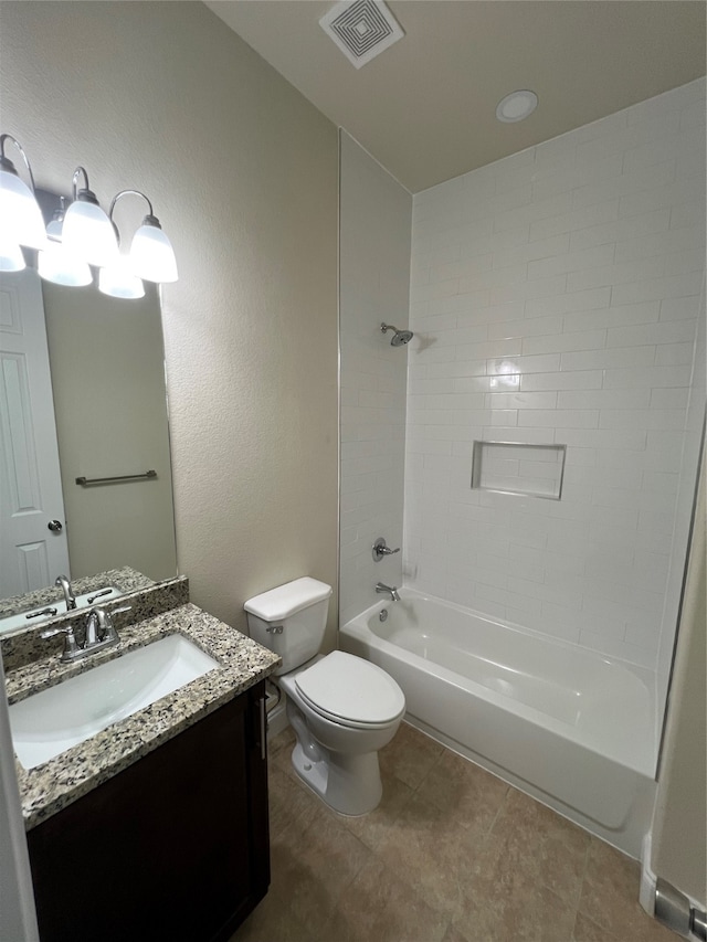 full bathroom with tiled shower / bath, vanity, tile patterned flooring, and toilet