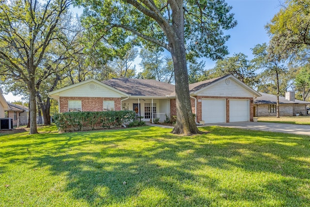 single story home with central AC, a garage, covered porch, and a front yard