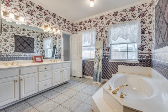 bathroom featuring crown molding, vanity, tile patterned flooring, and a washtub