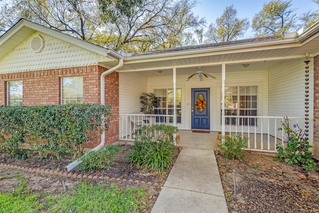 view of exterior entry with covered porch