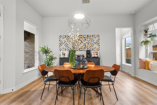 dining area with hardwood / wood-style floors