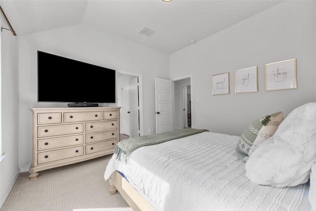 carpeted bedroom featuring vaulted ceiling