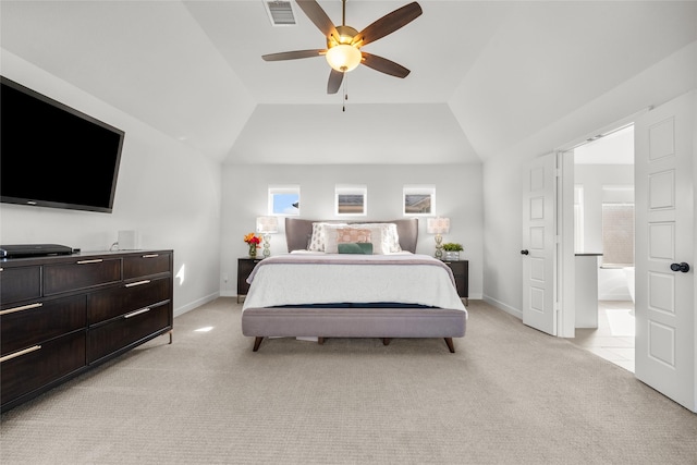 bedroom with ceiling fan, light carpet, and vaulted ceiling