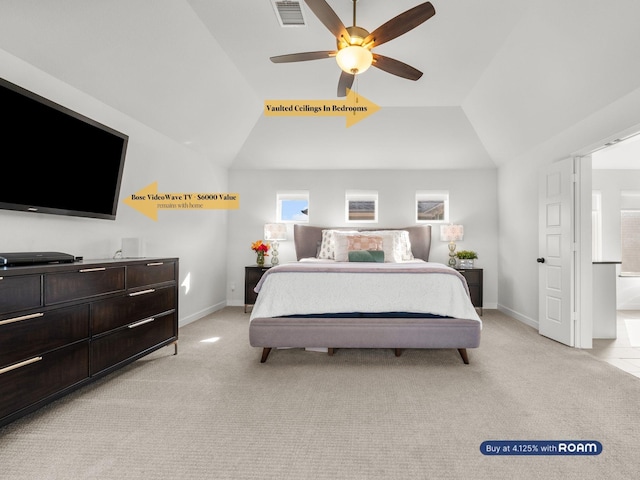 bedroom featuring visible vents, light carpet, baseboards, and vaulted ceiling