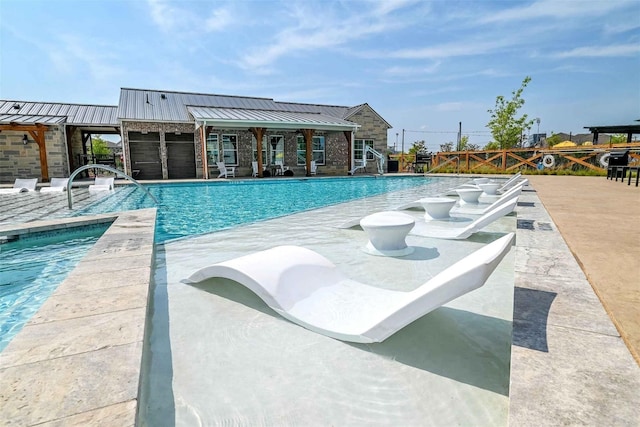 view of pool featuring a patio area