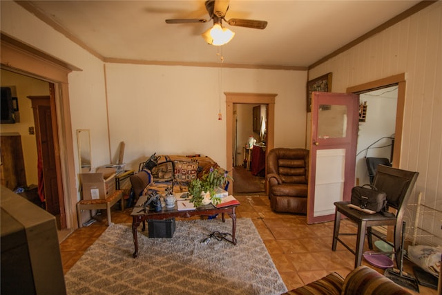 living room featuring crown molding, ceiling fan, and light tile patterned floors