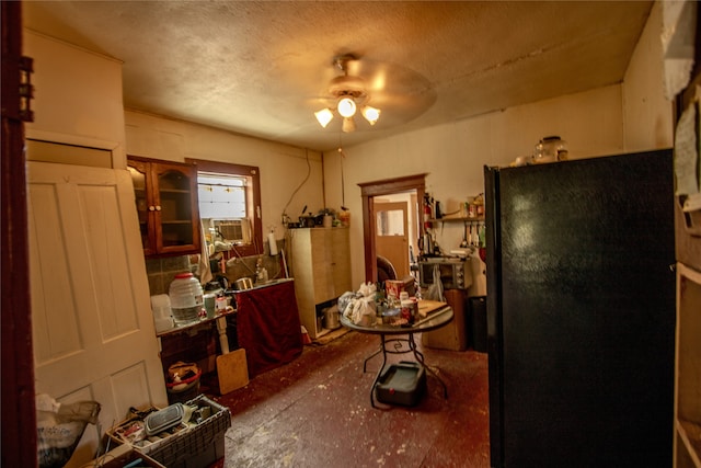 miscellaneous room featuring a textured ceiling and ceiling fan