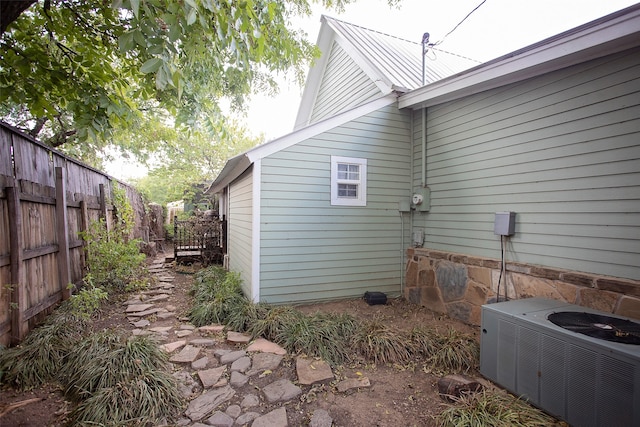 view of property exterior with central AC unit