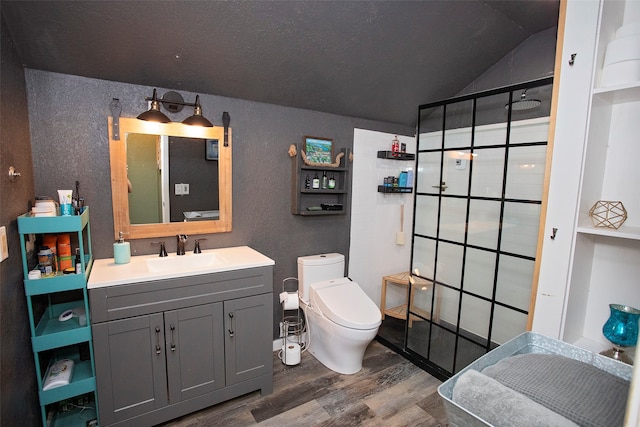 bathroom featuring lofted ceiling, walk in shower, vanity, hardwood / wood-style flooring, and toilet