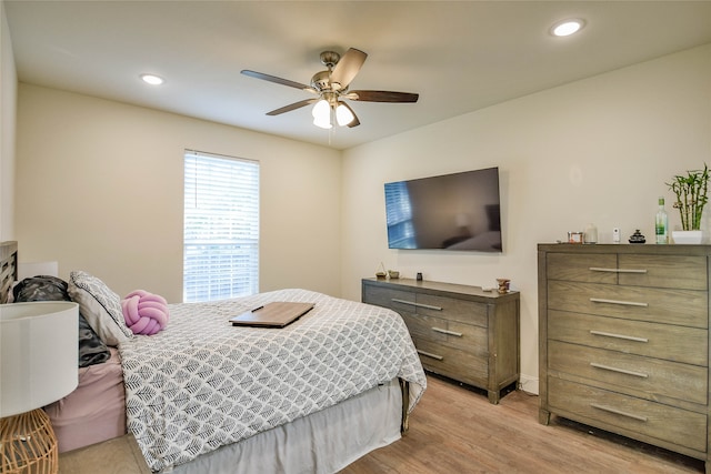 bedroom featuring ceiling fan and light hardwood / wood-style floors