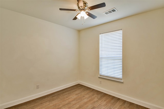 unfurnished room featuring light wood-type flooring and ceiling fan