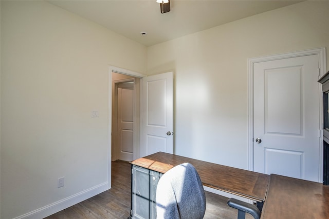 office area with ceiling fan and dark hardwood / wood-style flooring