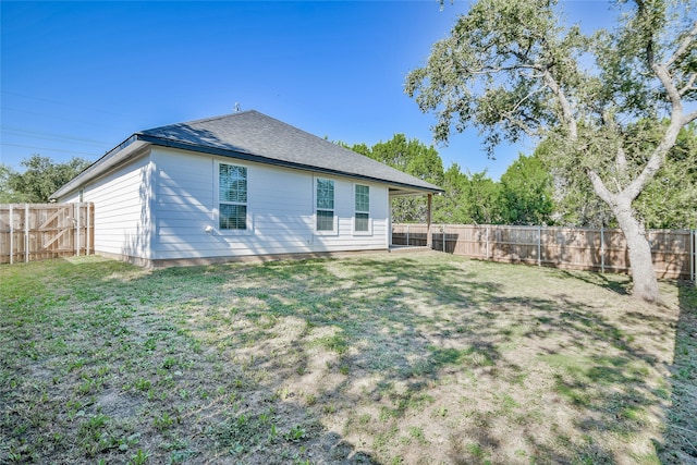 back of house with a yard