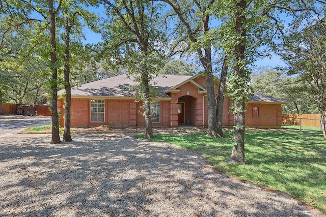 ranch-style house with a front lawn