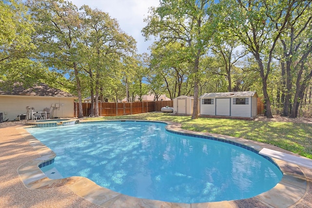 view of swimming pool with a yard, central AC, and a shed