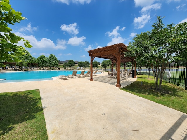 view of swimming pool with a patio area, a lawn, and a pergola