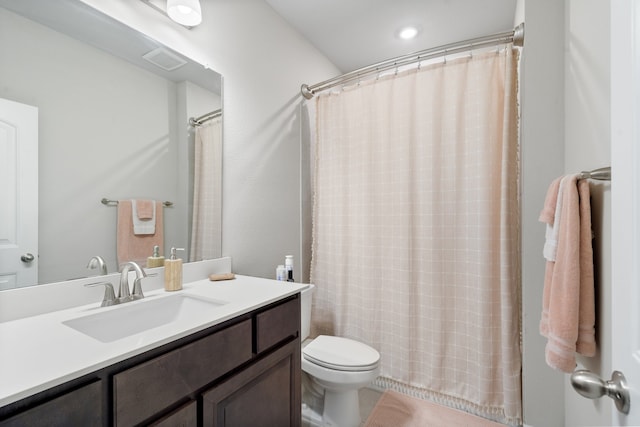 bathroom with vanity, toilet, and a shower with shower curtain