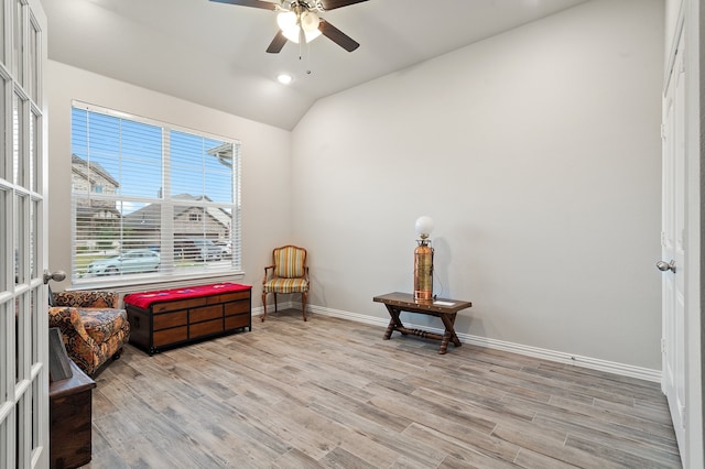 sitting room featuring lofted ceiling, light wood-type flooring, and ceiling fan