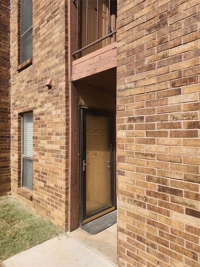 property entrance with a balcony