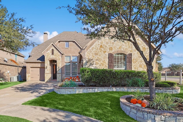 view of front of home featuring central AC unit and a front lawn