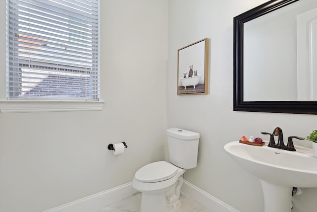 bathroom with sink and toilet