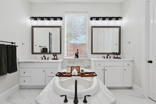 bathroom featuring vanity and a bath