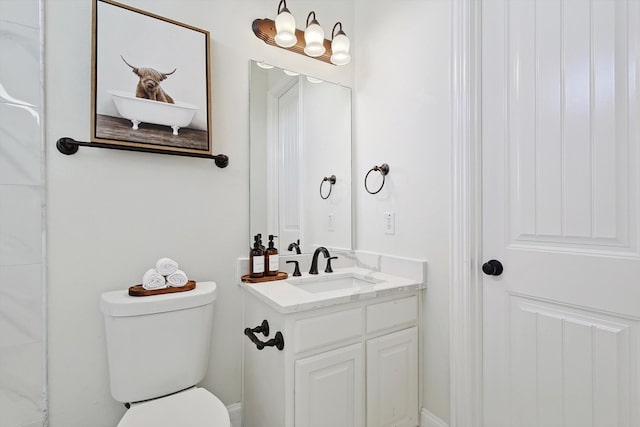 bathroom with vanity and toilet