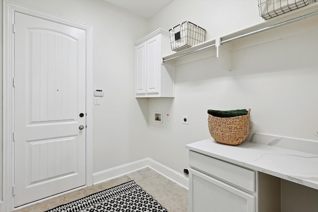 laundry area featuring hookup for a washing machine, light tile patterned floors, cabinets, and hookup for an electric dryer