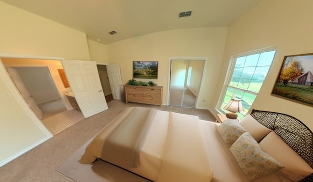 bedroom with light carpet and vaulted ceiling