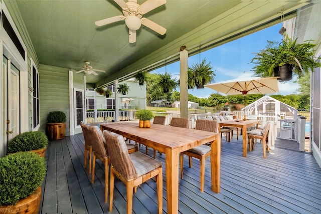 wooden terrace featuring ceiling fan