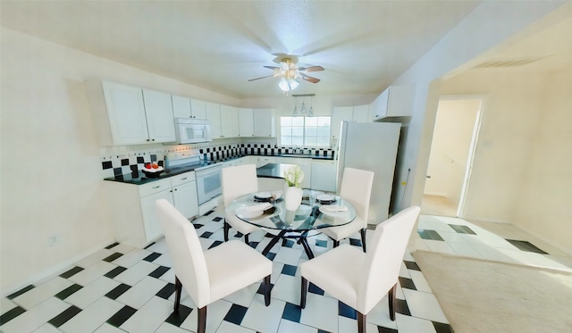 dining space with ceiling fan