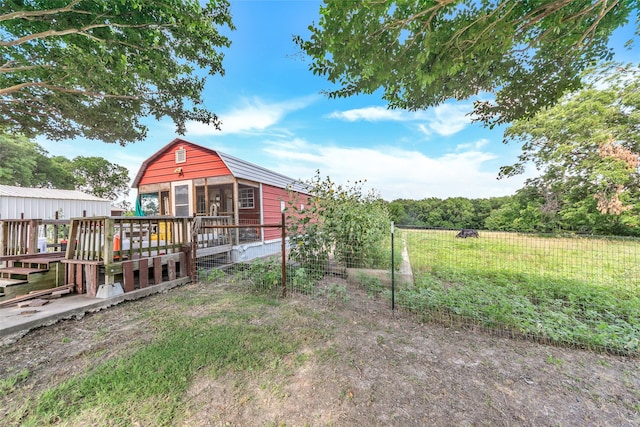 view of yard featuring a wooden deck