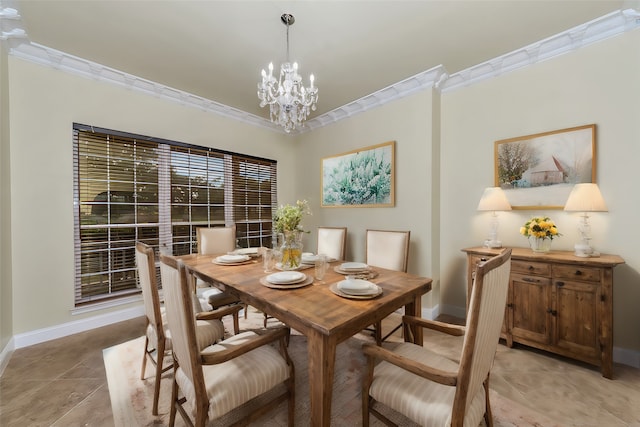 dining area featuring crown molding and a chandelier