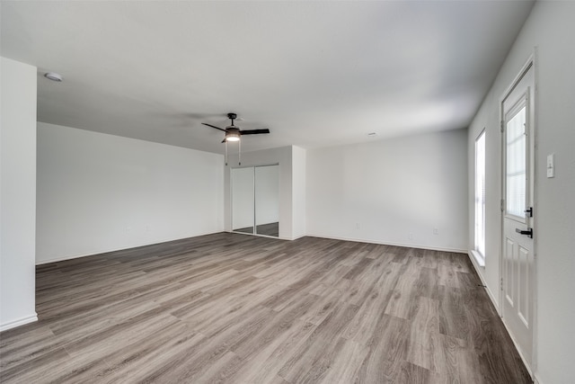 interior space featuring light hardwood / wood-style flooring and ceiling fan