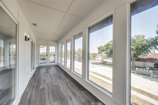 unfurnished sunroom with french doors