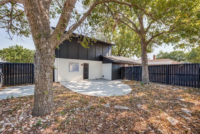 rear view of property featuring a patio