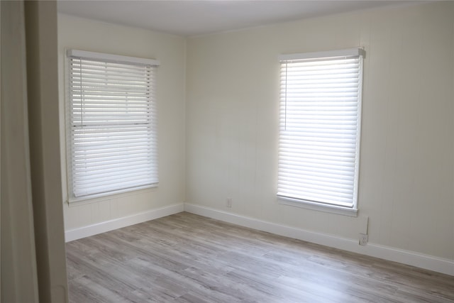 spare room featuring light wood-type flooring