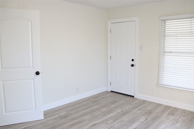 spare room featuring light hardwood / wood-style floors