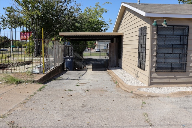 view of home's exterior featuring a carport